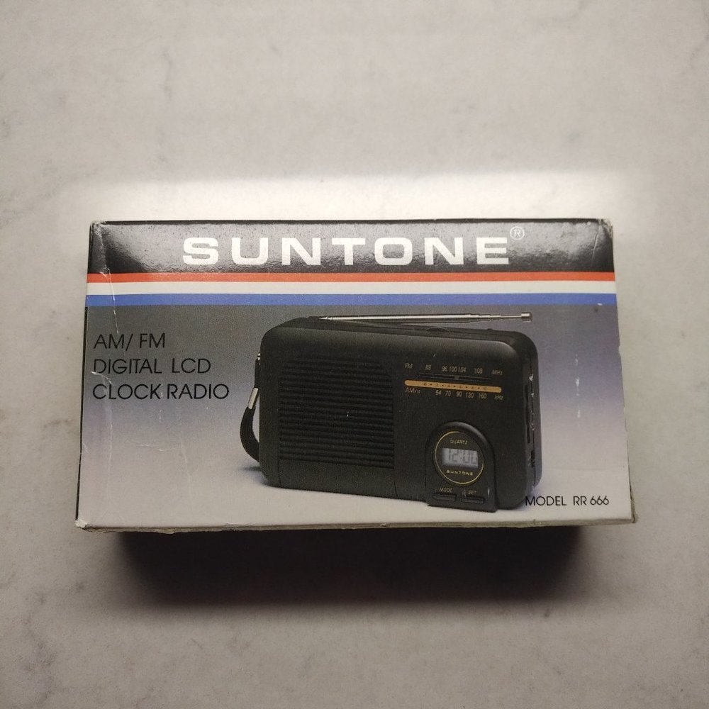 BRAND NEW SUNTONE AM/ FM DIGITAL LCD CLOCK RADIO, MODEL RR-666, IN ORIGINAL BOX